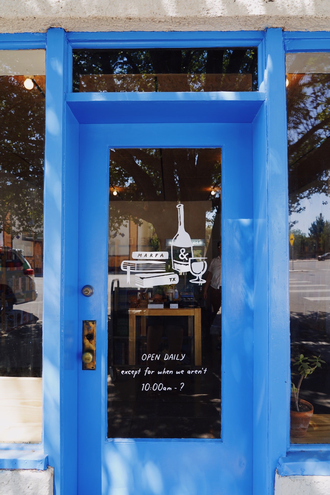 Bright blue entrance door at Stop and Read Books in Marfa